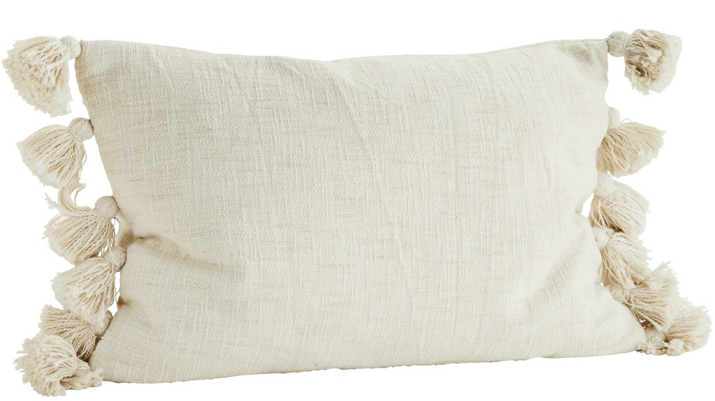 coussin écru à pompons