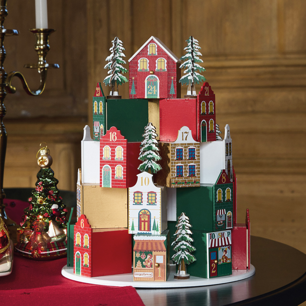 calendrier de noël en forme de village rouge et vert